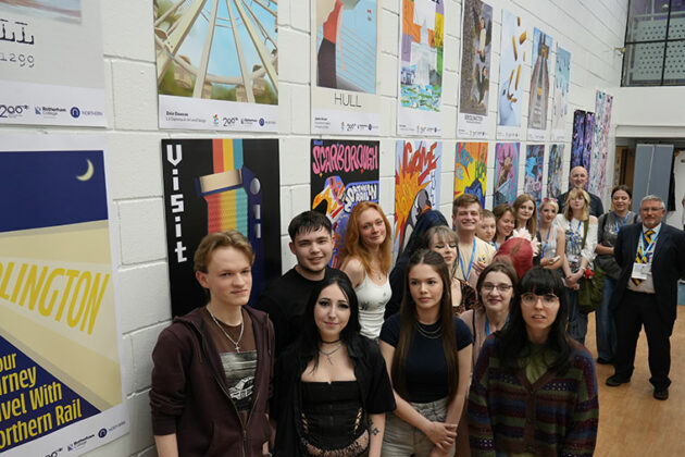 Rotherham College's creative showcase 2025 - Students stood by their work on the walls